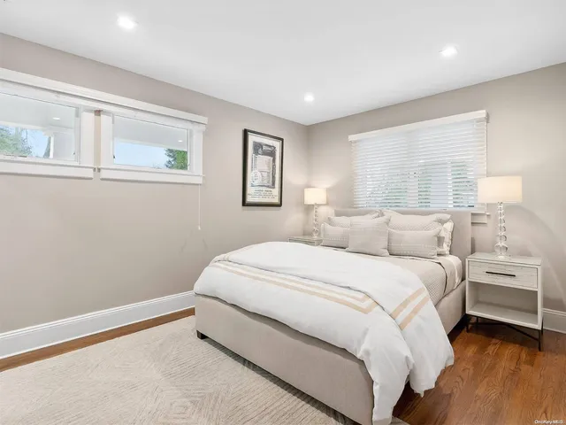 a large white bed in a white room