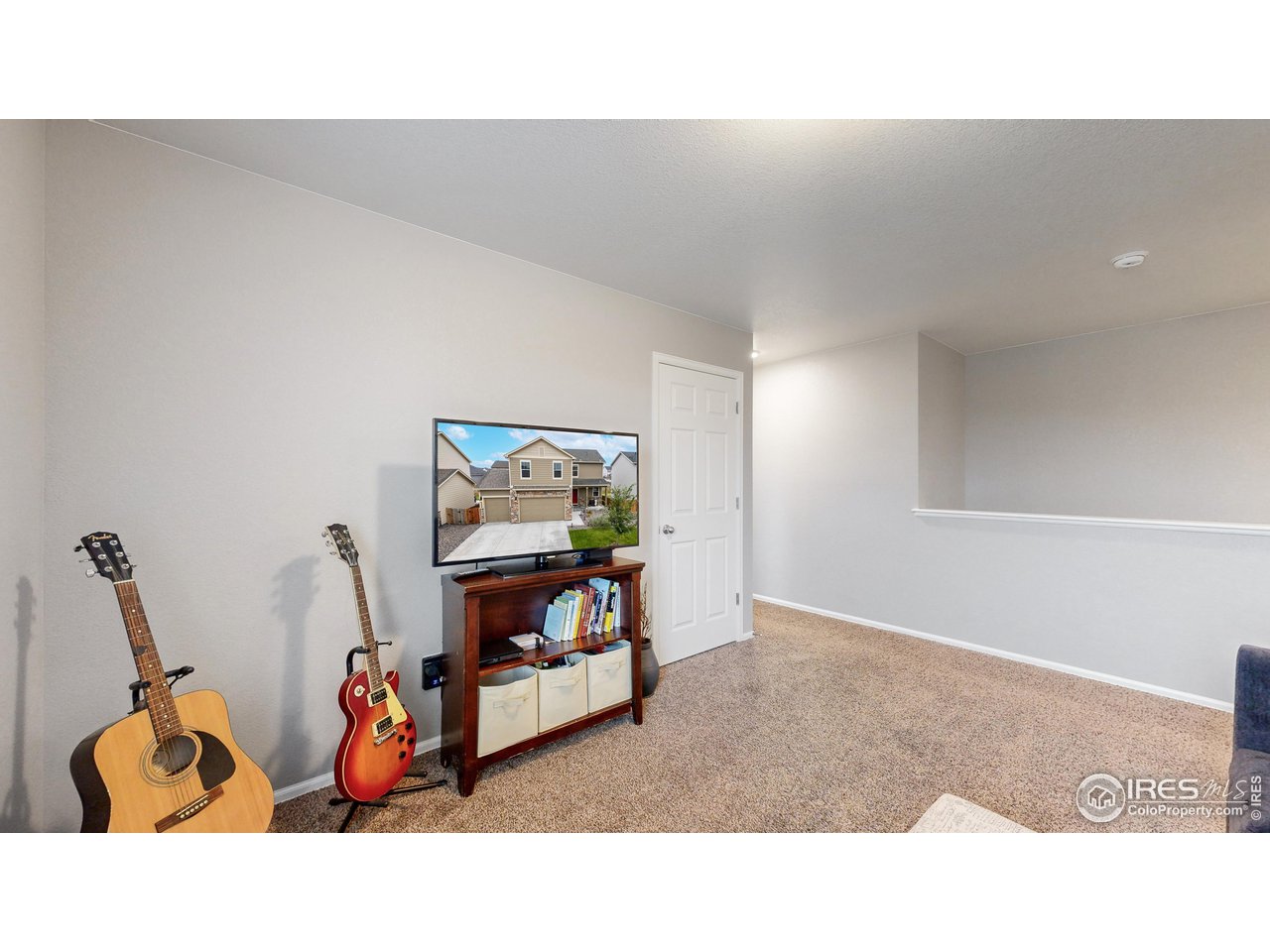 933 Keneally Court Windsor, CO 80550 - Photo 22 of 40 a living room with furniture and a gym machine
