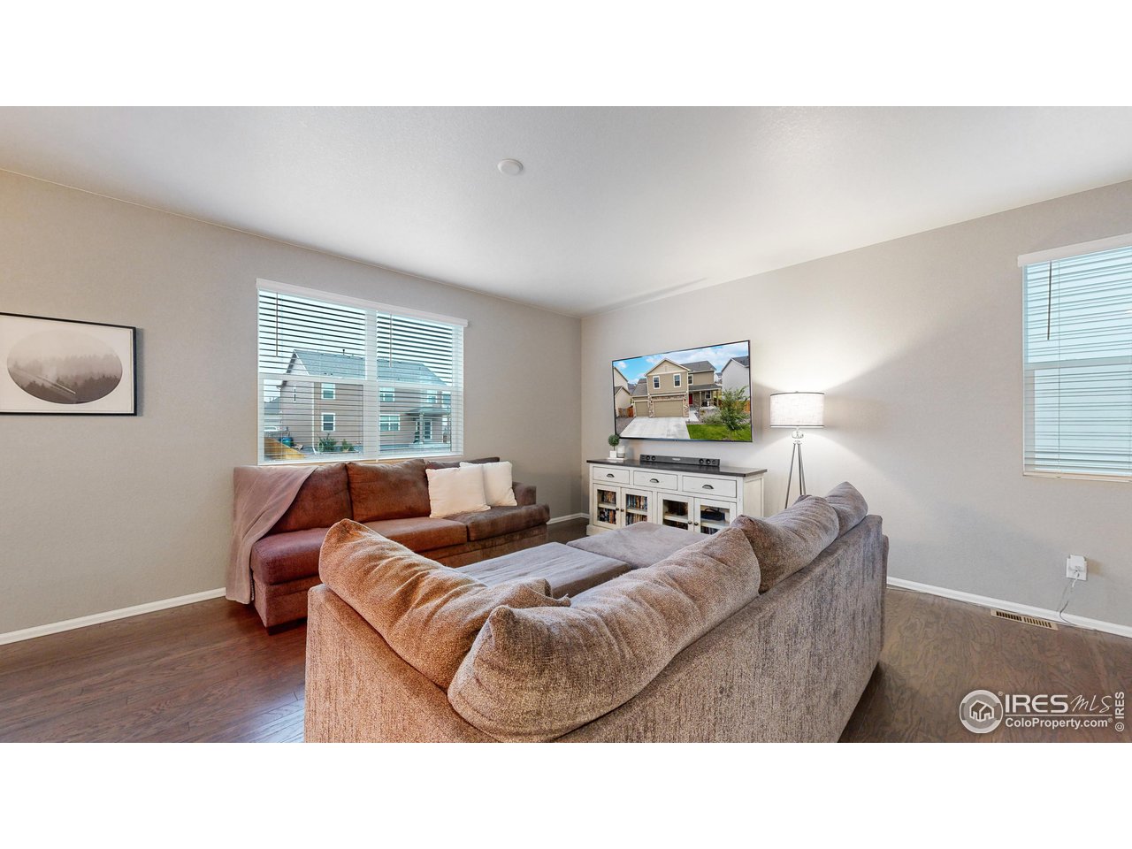 933 Keneally Court Windsor, CO 80550 - Photo 6 of 40 a living room with furniture and a window