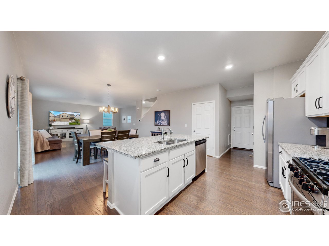 933 Keneally Court Windsor, CO 80550 - Photo 7 of 40 a kitchen with sink and cabinets