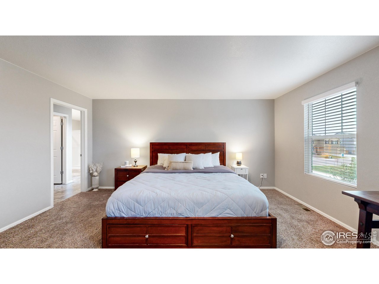 933 Keneally Court Windsor, CO 80550 - Photo 10 of 40 a living room with furniture and a window