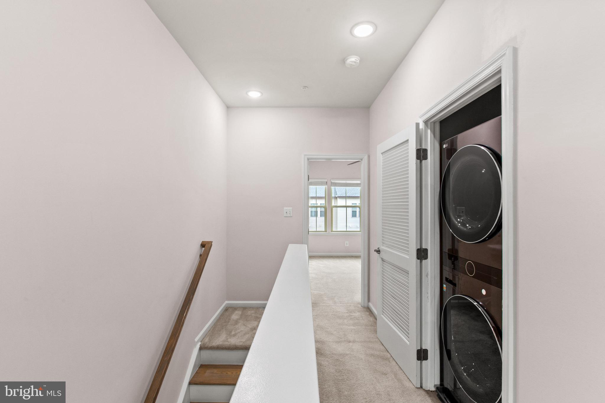 3753 Valley Ford Way Hanover, MD 21076 - Photo 15 of 35 a view of a hallway with washer and dryer