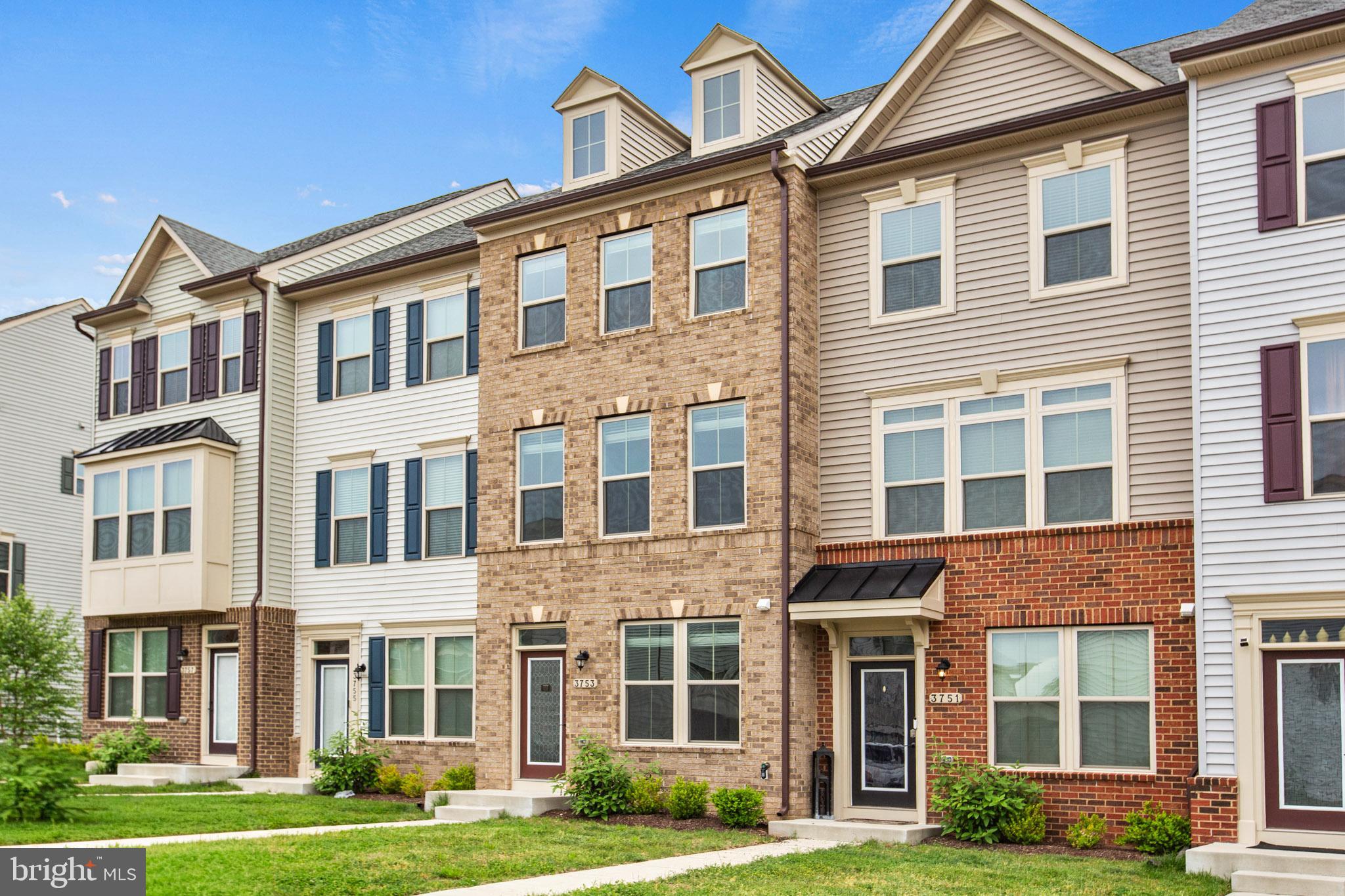 3753 Valley Ford Way Hanover, MD 21076 - Photo 33 of 35 a front view of a residential apartment building with a yard