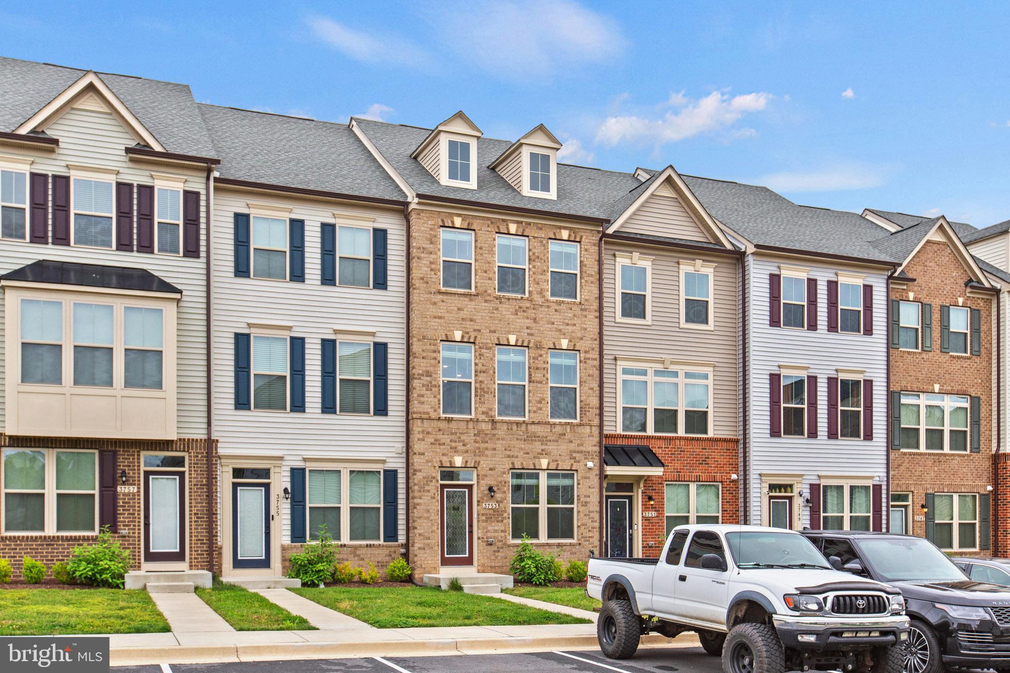 3753 Valley Ford Way Hanover, MD 21076 - Photo 34 of 35 a front view of a residential apartment building with a yard