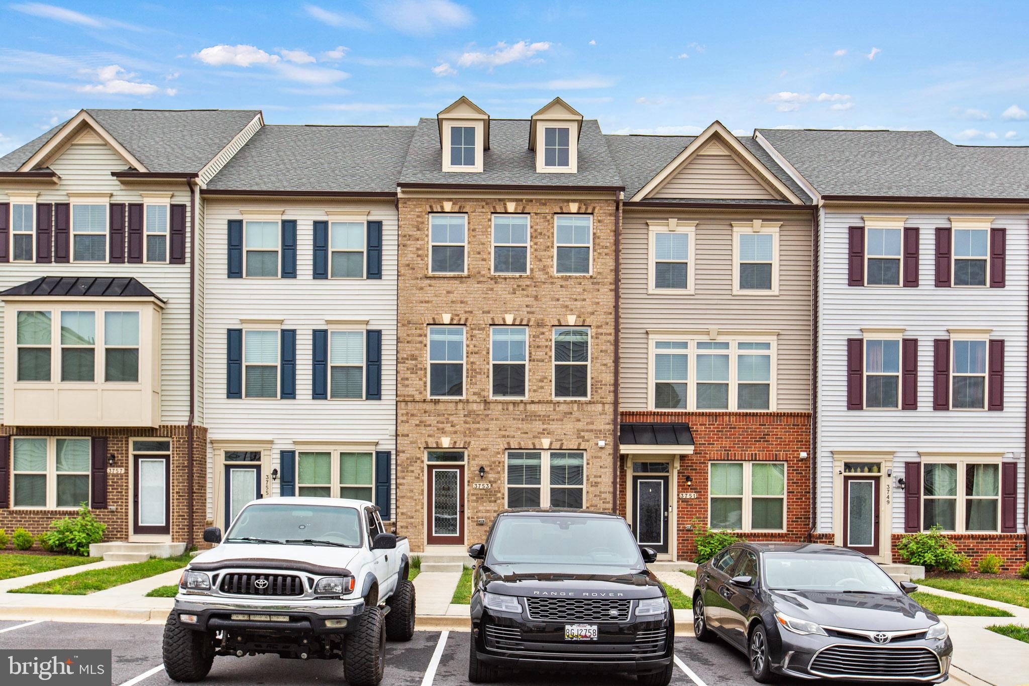 3753 Valley Ford Way Hanover, MD 21076 - Photo 35 of 35 a front view of a residential apartment building with a yard