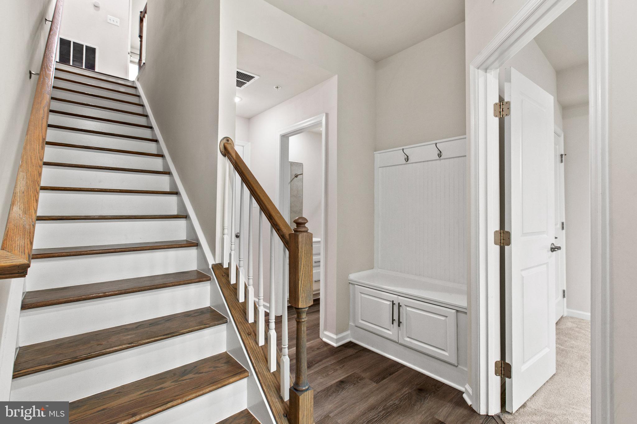 3753 Valley Ford Way Hanover, MD 21076 - Photo 5 of 35 a view of a hallway with wooden floor and entryway