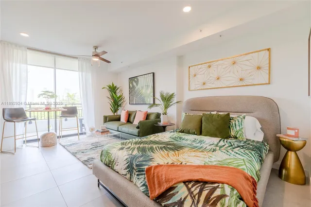 a bedroom with a bed and glass walk in closet