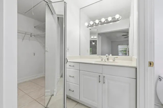 a bathroom with a double vanity sink and mirror