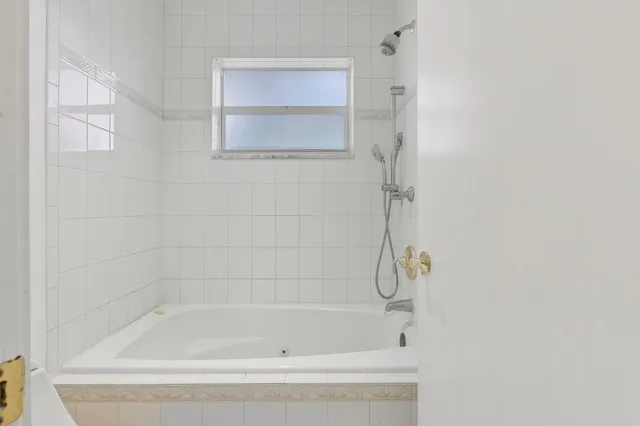 a close up of a bathtub curtain