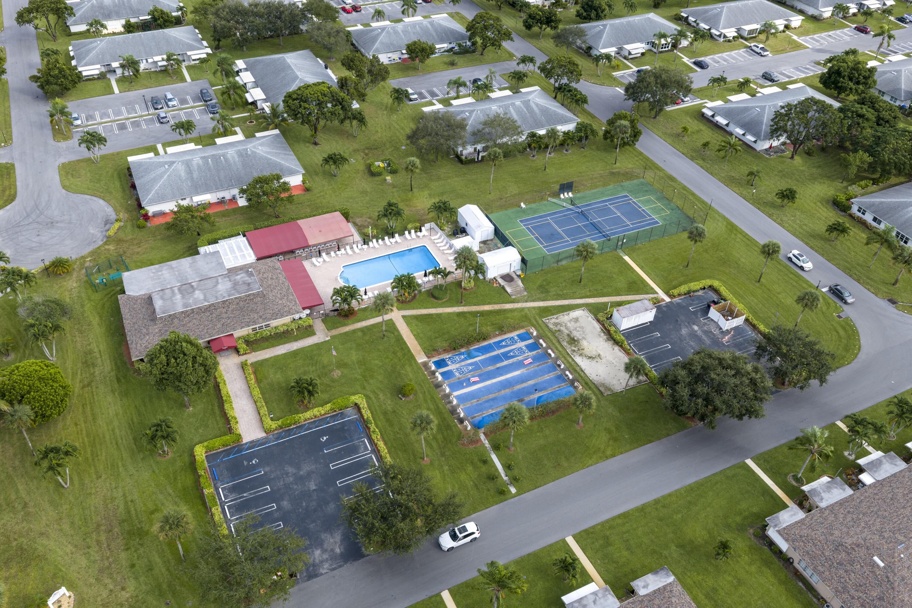 1167 South Drive Circle, Unit D Delray Beach, FL 33445 - Photo 25 of 26 an aerial view of a house with a garden