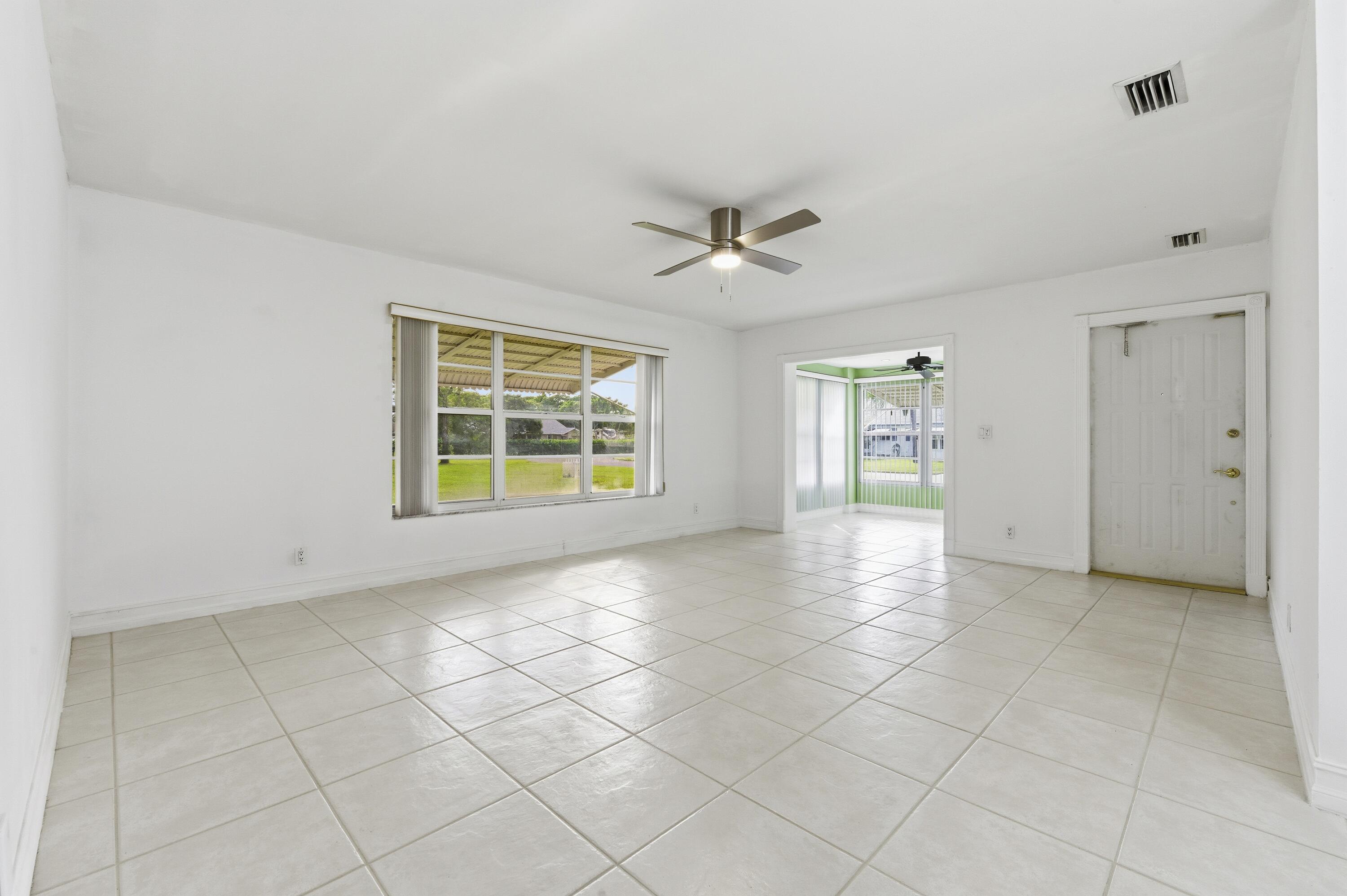 1167 South Drive Circle, Unit D Delray Beach, FL 33445 - Photo 3 of 26 a view of an empty room with a window