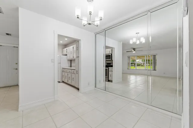 a view of a hallway with a chandelier