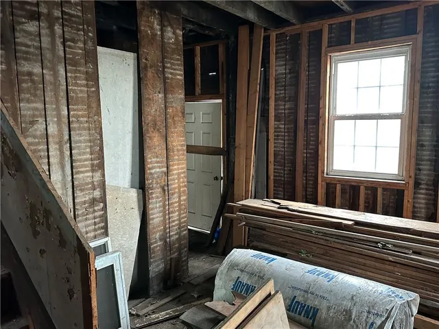 a view of sitting area with wooden floor and stairs