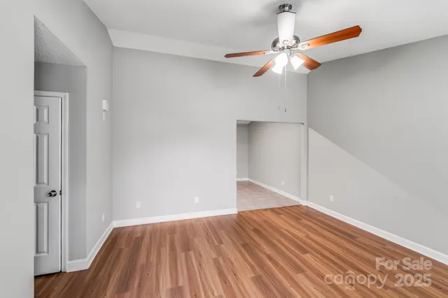 a large kitchen with stainless steel appliances granite countertop a stove a sink dishwasher and a refrigerator