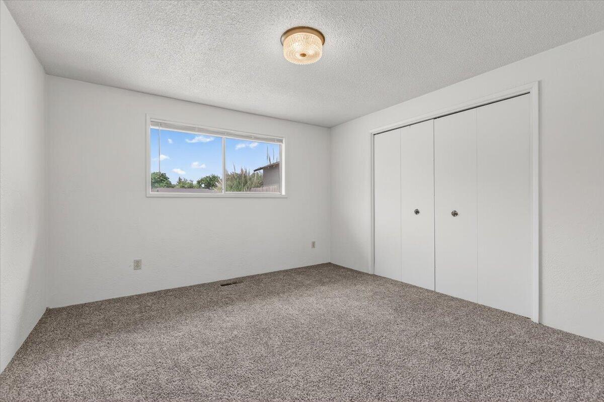 415 Sutter Avenue Medford, OR 97504 - Photo 15 of 28 a view of an empty room with a window