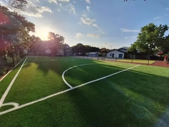 a view of a porch with furniture and garden