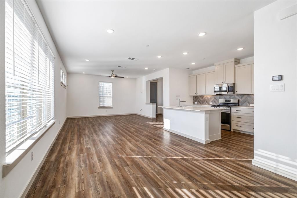 699 Vista Oak Road Lewisville, TX 75067 - Photo 34 of 35 a view of kitchen with wooden floor and electronic appliances
