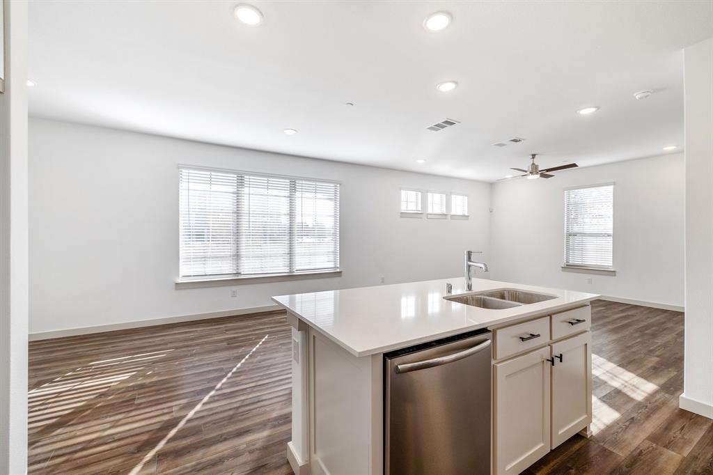 699 Vista Oak Road Lewisville, TX 75067 - Photo 35 of 35 a kitchen with stainless steel appliances granite countertop a sink stove and cabinets