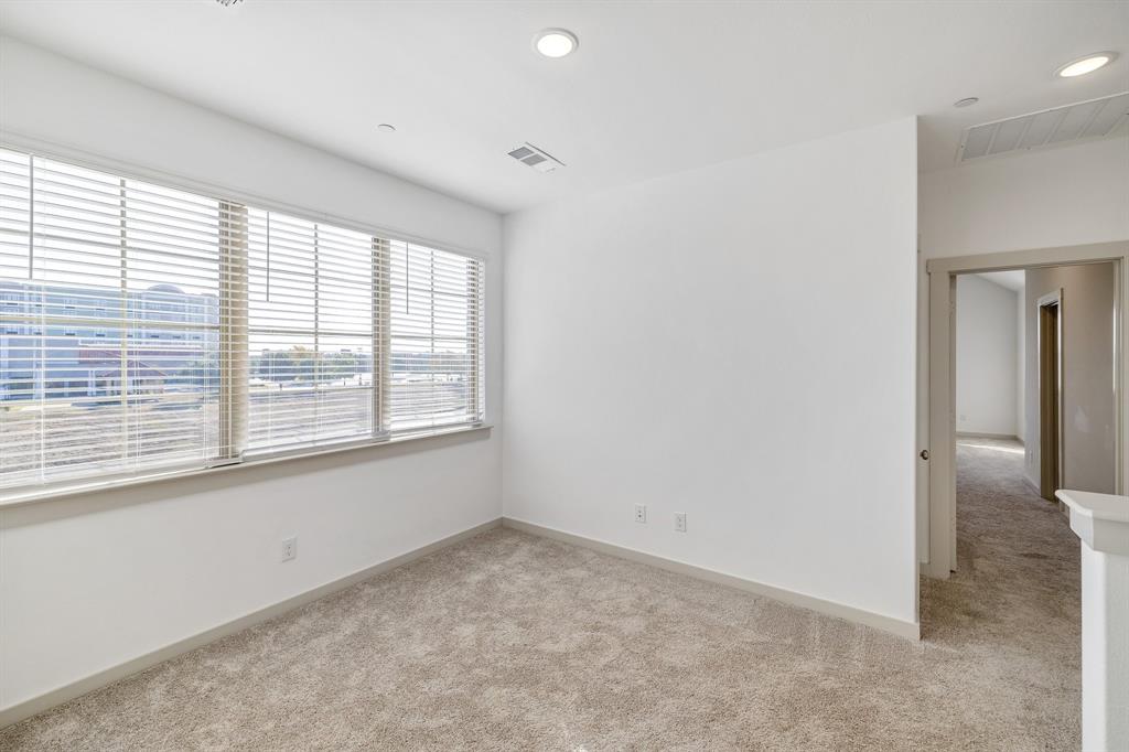 699 Vista Oak Road Lewisville, TX 75067 - Photo 19 of 35 a view of an empty room with a window