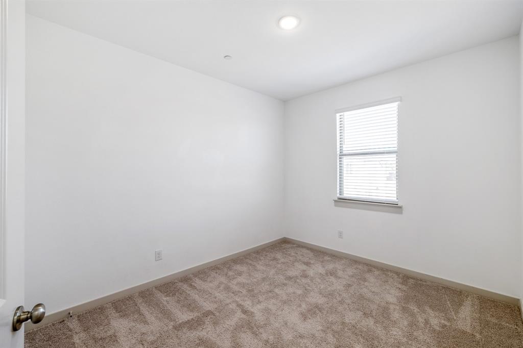 699 Vista Oak Road Lewisville, TX 75067 - Photo 21 of 35 an empty room with a window