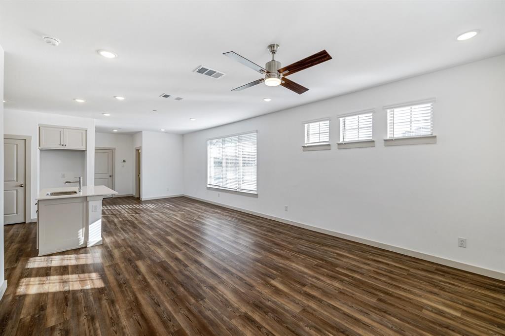 699 Vista Oak Road Lewisville, TX 75067 - Photo 8 of 35 a view of empty room with wooden floor and window