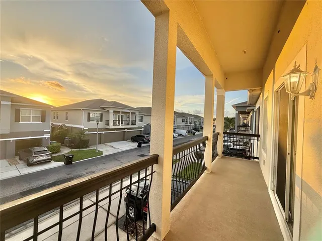a view of a balcony with chairs