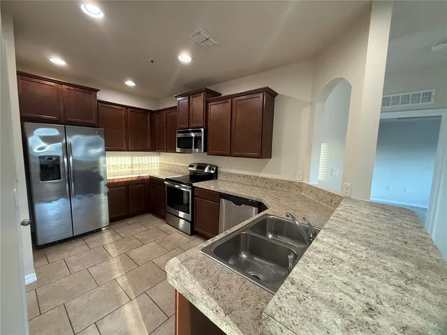 a kitchen with a stove and a sink