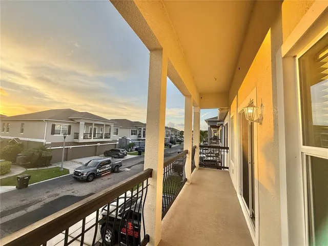 a view of a balcony with car parked