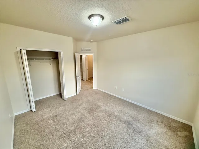 a bathroom with a sink and mirror with toilet