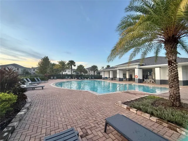 a view of a lake with houses in the back