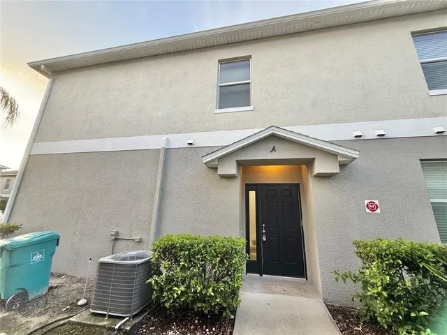 a front view of a house with garage