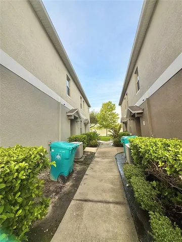 a view of a backyard with potted plants