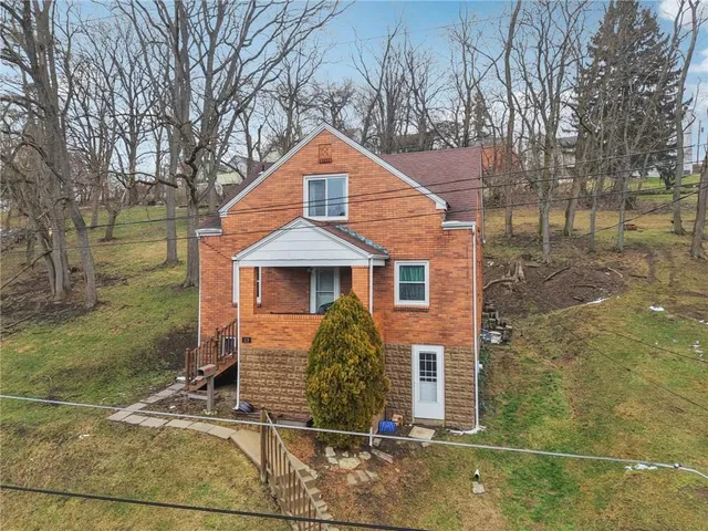 a front view of a house with yard