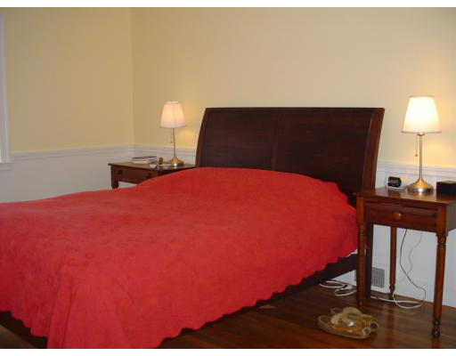 10 Richland Road Wellesley, MA 02481 - Photo 12 of 18 a bedroom with a bed and a lamp