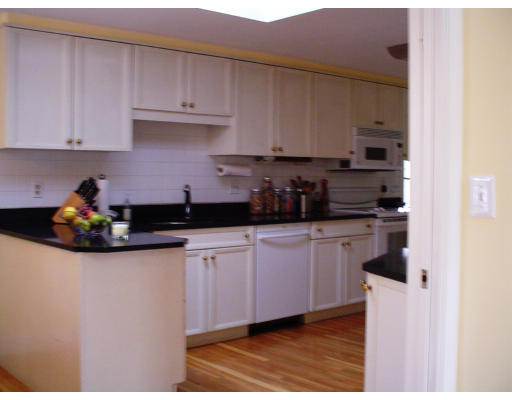 10 Richland Road Wellesley, MA 02481 - Photo 3 of 18 a kitchen with stainless steel appliances granite countertop a sink a stove and cabinets
