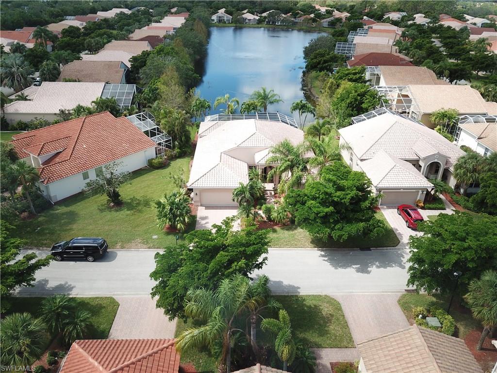 20483 Foxworth Circle Estero, FL 33928 - Photo 1 of 25 an aerial view of residential house with outdoor space and lake view