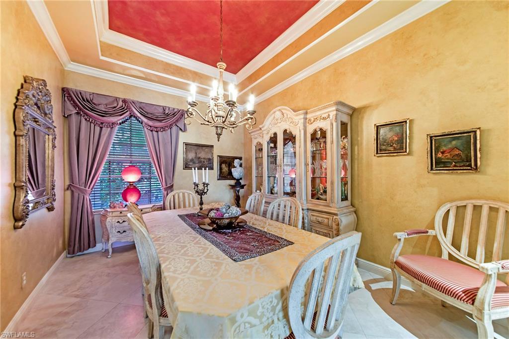 20483 Foxworth Circle Estero, FL 33928 - Photo 13 of 25 a view of a dining room with furniture and chandelier