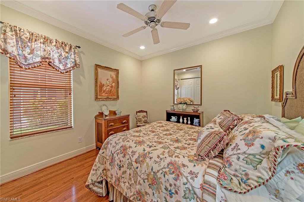 20483 Foxworth Circle Estero, FL 33928 - Photo 14 of 25 a bedroom with a bed and a window