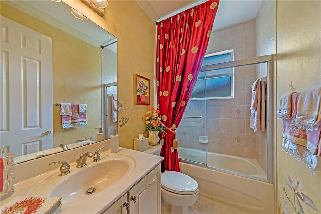20483 Foxworth Circle Estero, FL 33928 - Photo 15 of 25 a bathroom with a sink toilet and shower