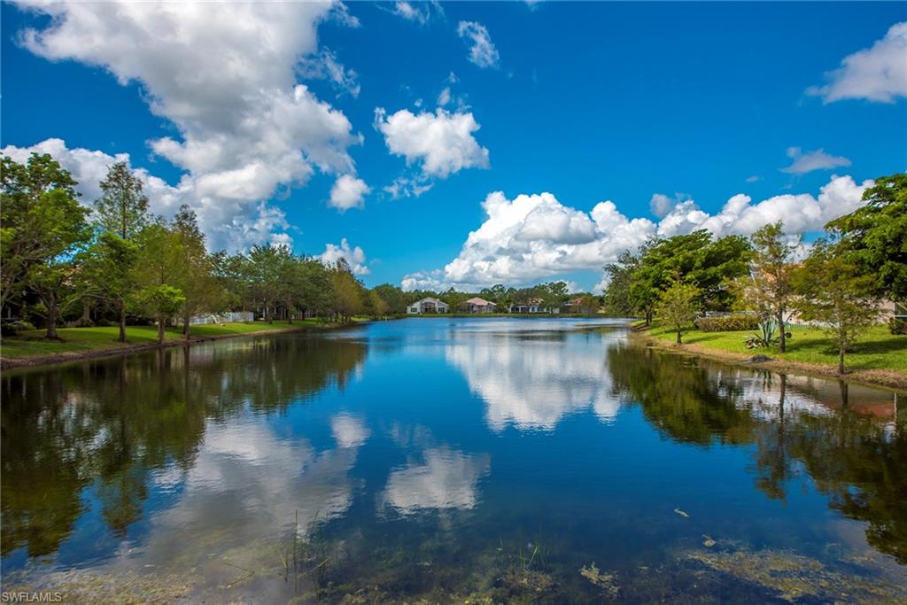 20483 Foxworth Circle Estero, FL 33928 - Photo 24 of 25 a view of a lake in between two chairs