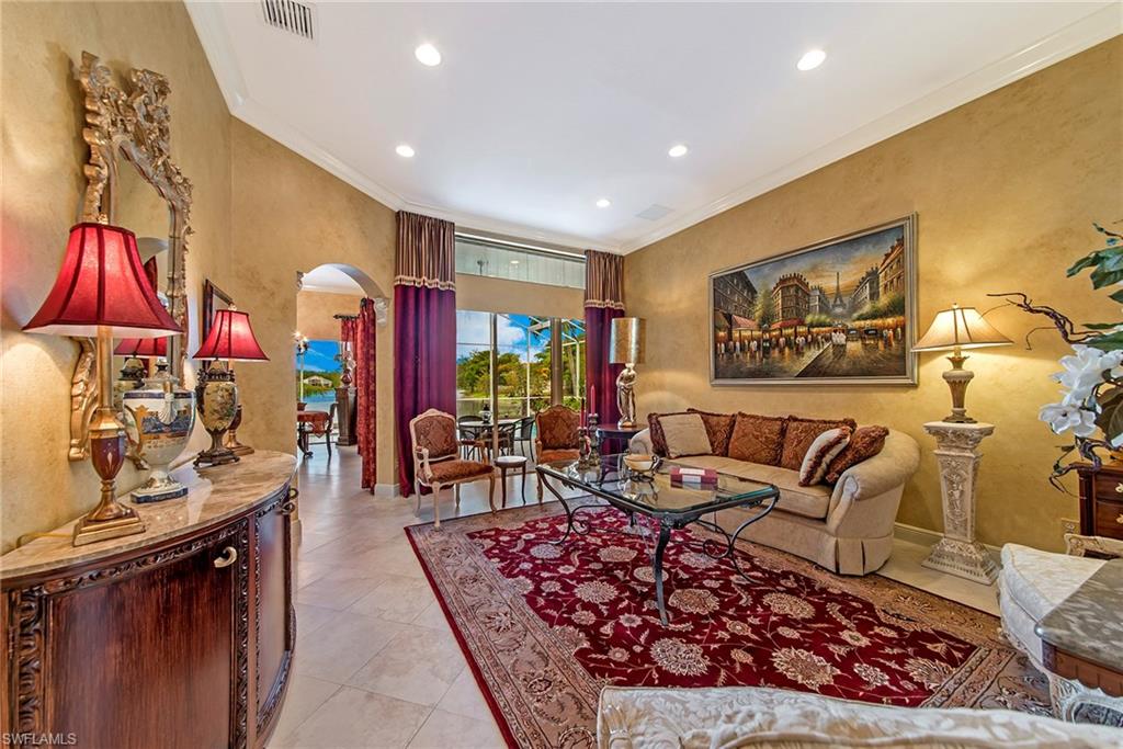 20483 Foxworth Circle Estero, FL 33928 - Photo 5 of 25 a living room with furniture and a flat screen tv