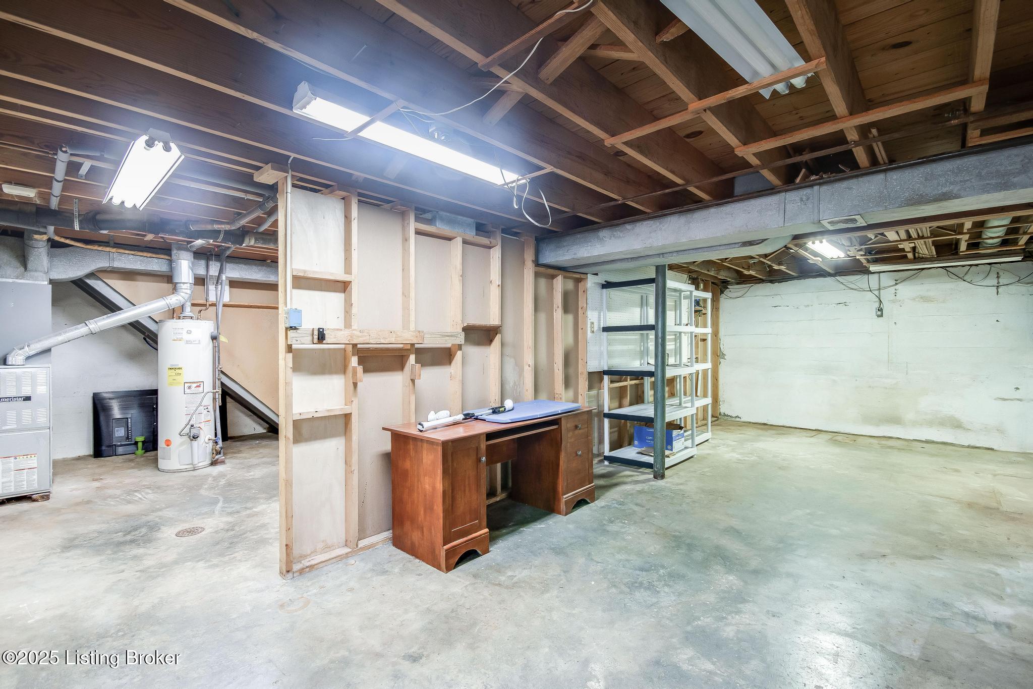 9611 Fairground Road Louisville, KY 40291 - Photo 35 of 57 Partially Unfinished Walkout Basement with HVAC unit, washer and dryer hookups, hot and cold sink and lots of additional storage.
