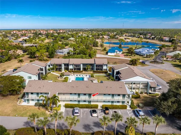 an aerial view of residential houses with outdoor space