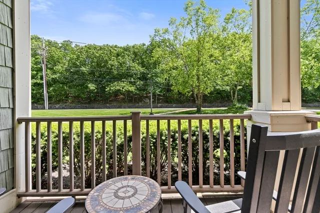 a view of a chair and table in the balcony