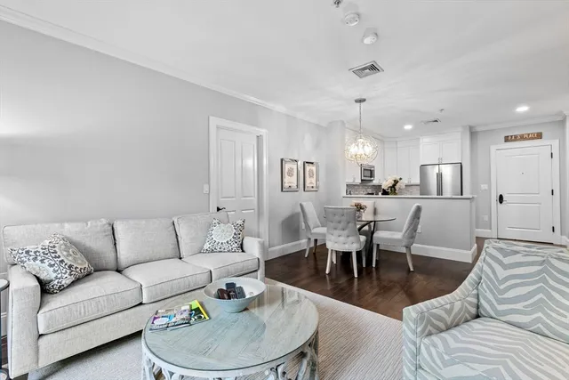a living room with furniture white walls and white walls