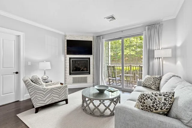 a living room with furniture or couch and a flat screen tv