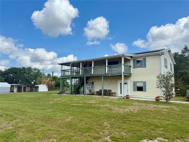 a view of a house with a big yard