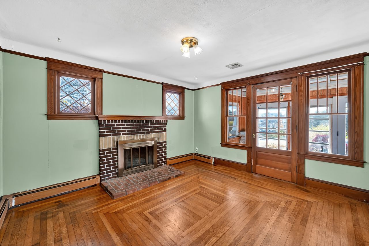 115 West Stafford Road Stafford, CT 06076 - Photo 19 of 39 a view of an empty room with glass door and wooden floor