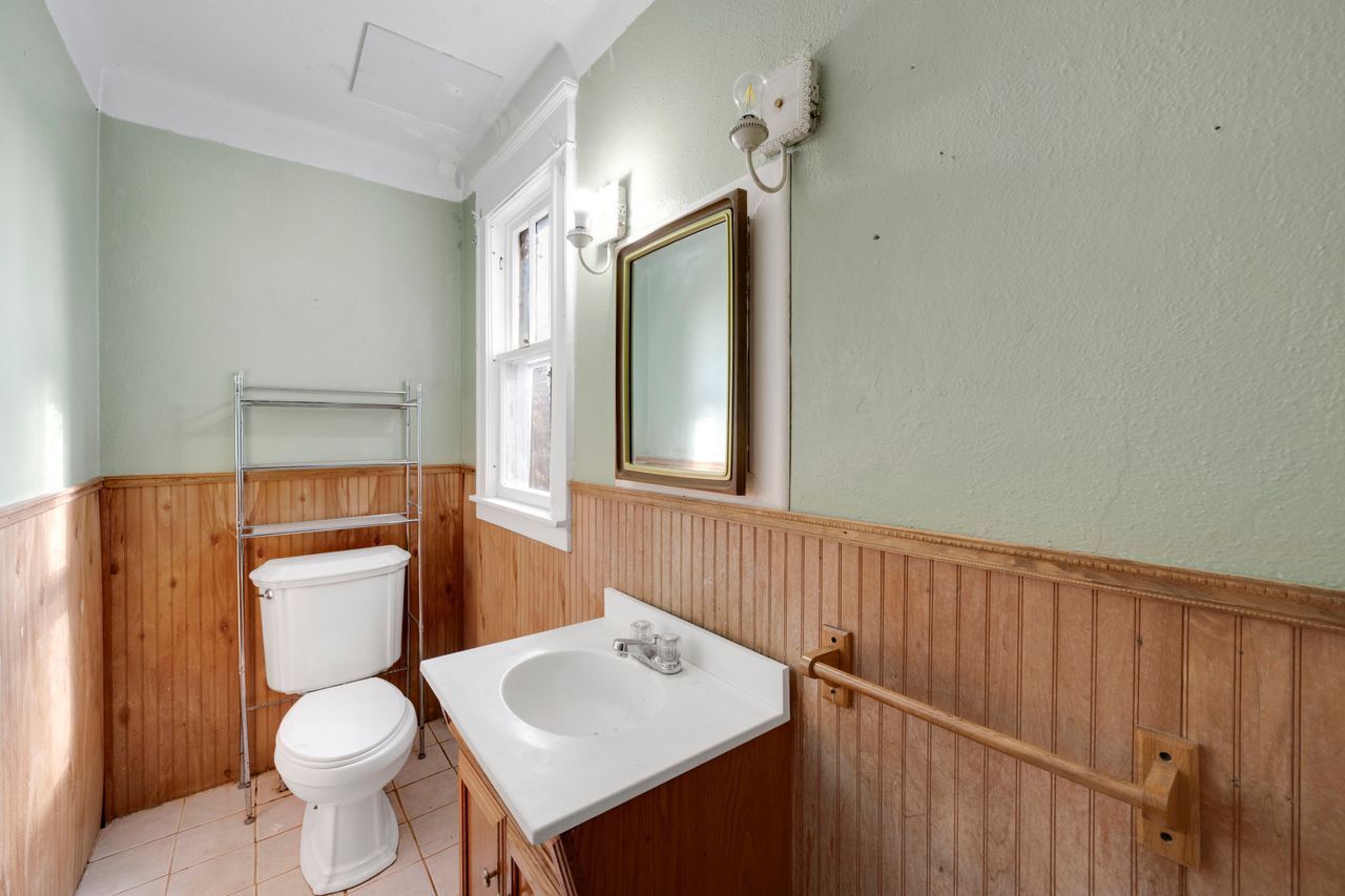 115 West Stafford Road Stafford, CT 06076 - Photo 22 of 39 a bathroom with a toilet sink and mirror