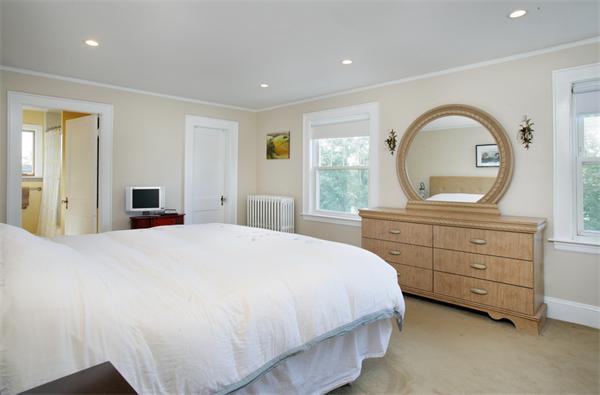 128 Lovell Road Watertown, MA 02472 - Photo 5 of 6 a bedroom with a bed and a dresser